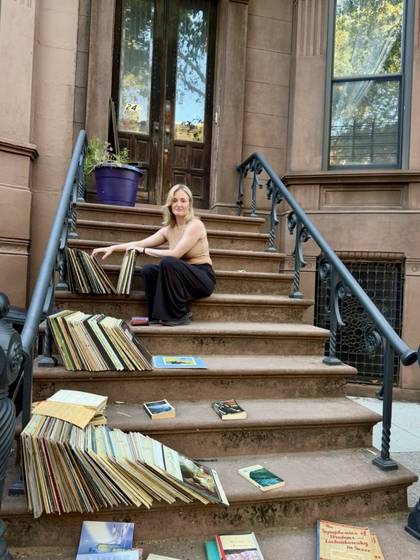 Kait Winey sorting records on a Brooklyn stoop